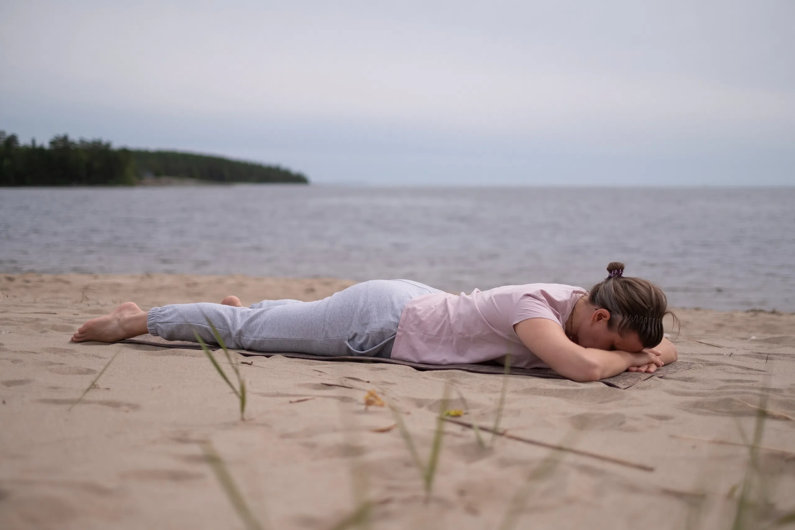 woman-relaxing-in-yoga-asana-makarasana.webp